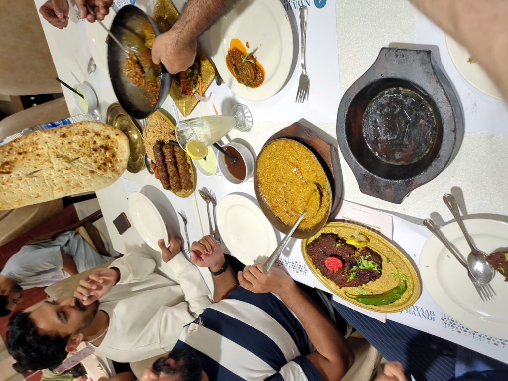 Vipin (left) and Rishav (right) enjoying Pakistani food at Nayaab Haandi